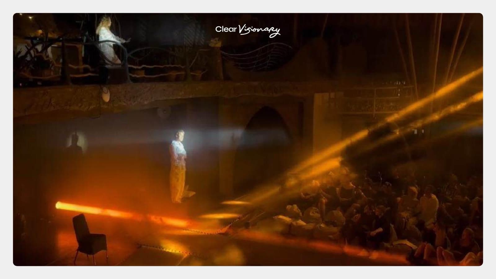 ASH Theatre at night — orange spotlights, a dancer mid-performance, audience in the round.