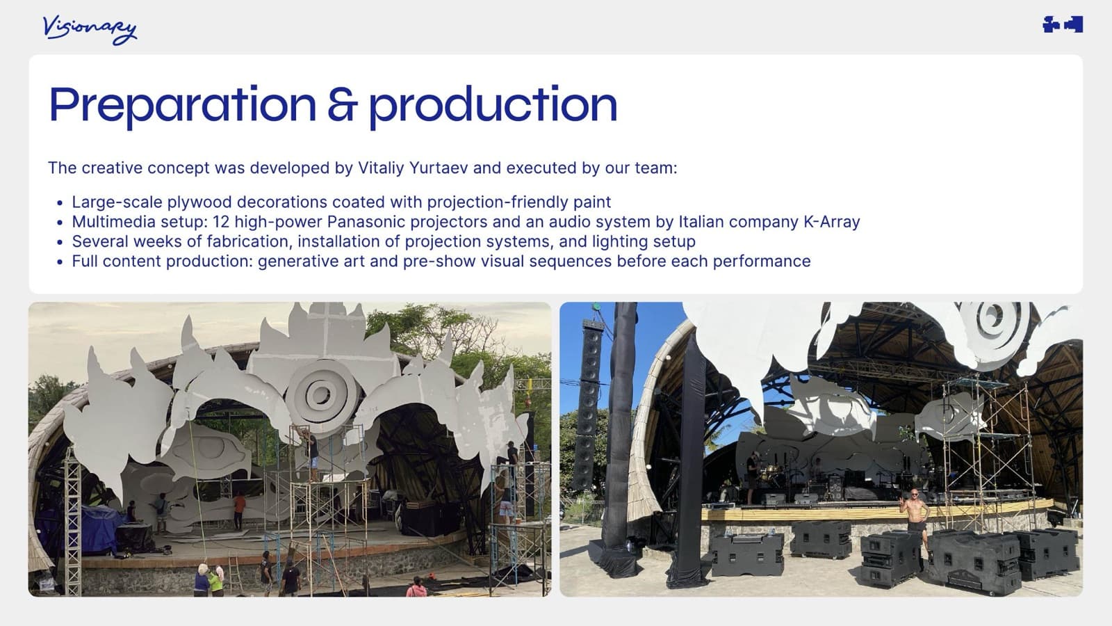 Production stage — large-scale plywood decorations, projector arrays, and audio system being installed.