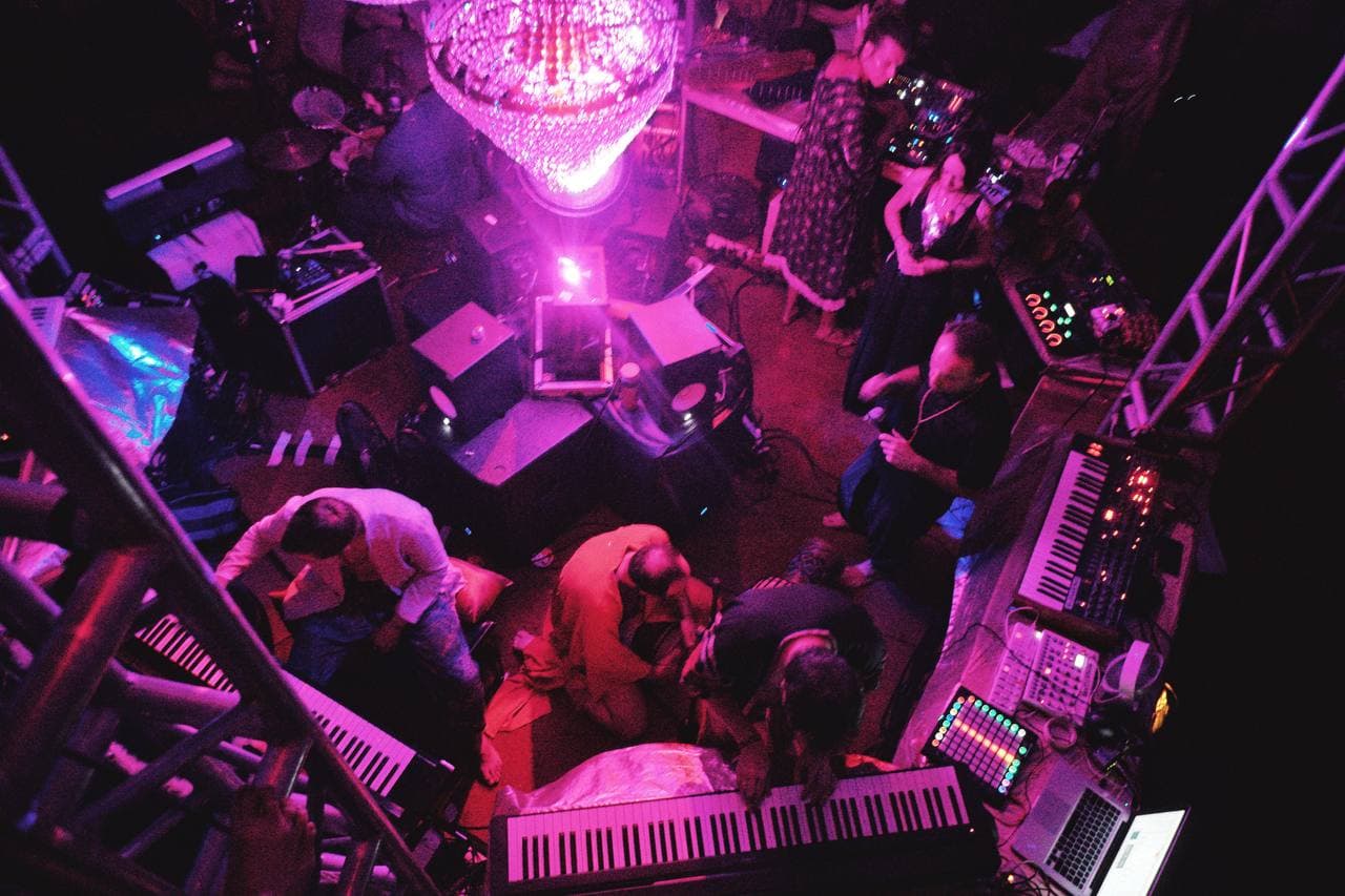 The Jam Hall booth seen from above — musicians surrounded by keyboards, controllers and laptops