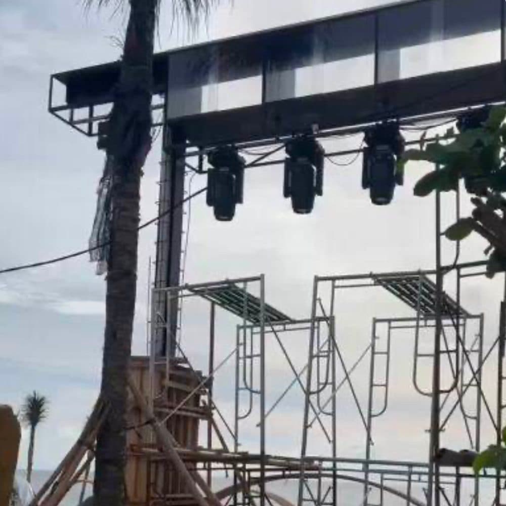 Lighting rig being installed on the venue's superstructure.