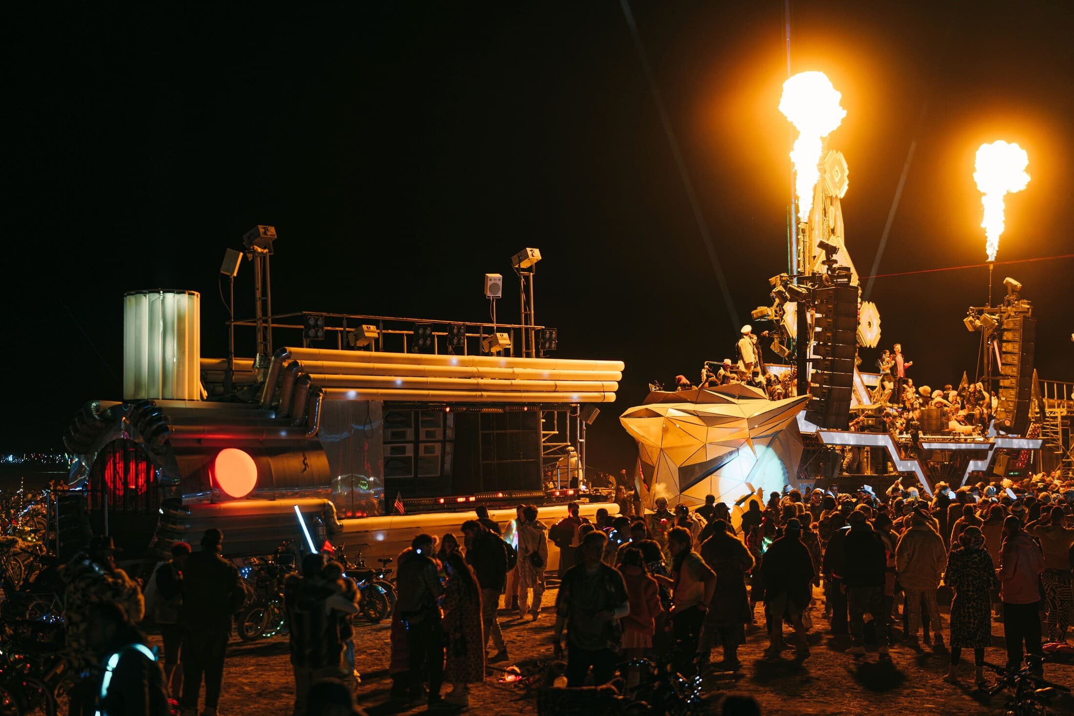 BiPolar Express alongside Mayan Warrior as flame effects rise above the crowd